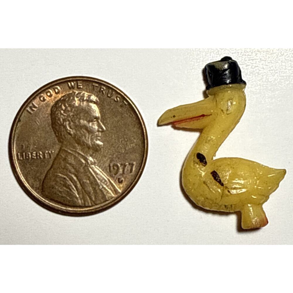 Vintage Pelican Cracker Jack Celluloid Charm 1A